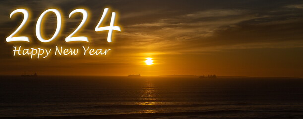 Happy New Year 2024: Orange Sky during sunset in Bloubergstrand, Cape Town in the Western Cape of...