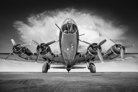 historical bomber plane against a dramatic sky