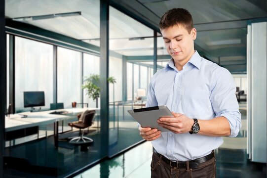 Happy business ceo standing in office with digital tablet, AI generated image