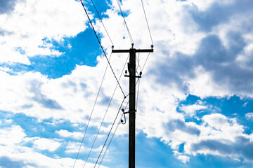 Power electric pole with line wire on colored background close up
