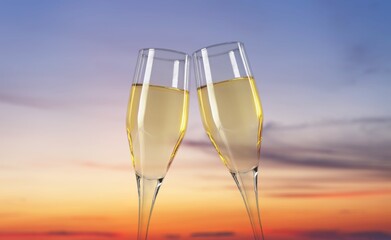 Cheers with beautiful wine glasses on sky background