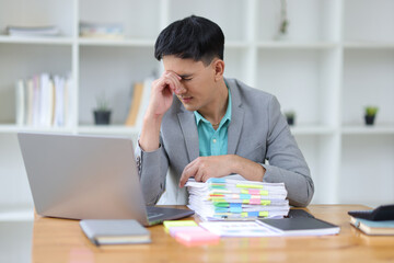 Fototapeta premium Businessman stressed from overwork and missed deadlines.