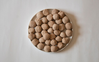 White clay stones on a white background
