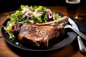 t-bone steak with salad on a plate with a fork