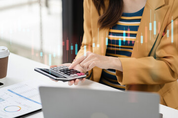 Close up of business woman working on calculator to calculate financial data report, accountancy...