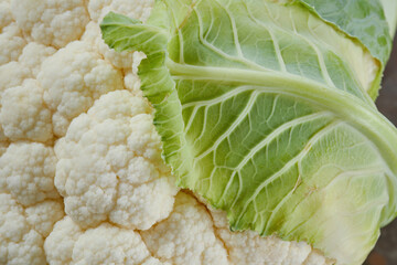 Fresh organic cauliflower with leaf. Shallow depth of field