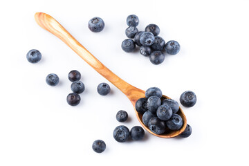 Fresh blueberries in wooden spoon