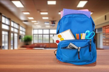 Naklejka premium Child's school backpack on table in classroom, AI generated image