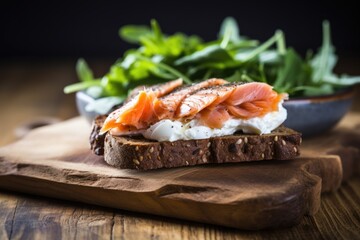 a rye bread sandwich with smoked salmon and cream cheese