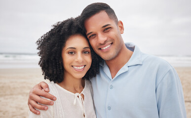 Couple, hug and portrait by ocean, smile and love in marriage, getaway and holiday for bonding. Mexican people, happy and relax at beach or sea, vacation and travel or trip, summer and peace by waves