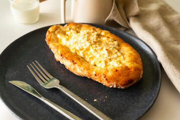 traditional Georgian cuisine.  Open pie with mozzarella cheese. Ajara khachapuri