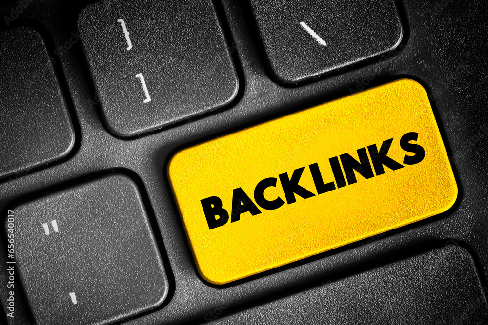 Aufkleber backlinks text button on keyboard, concept background
