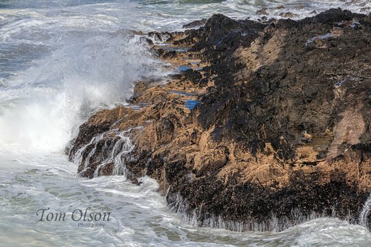 Waves pounding the rocky shore of the Pacific Ocean central Oregon coast. 