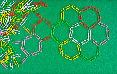 Business concept,collaboration,cooperation,teamwork, innovation,human resources,recruitment,team building with paperclips on green background,free copy space - 656541634