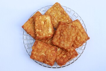 Tempeh, Tempe Goreng or Fried tempeh is Indonesia traditional food, made from fermented soybean seeds.