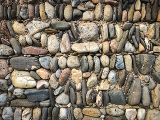 Rock and stone wall texture at the beach with Old brick stone wall background, High quality photo