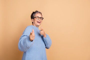 Photo portrait of lovely retired female fingers point you wear trendy blue knitwear outfit isolated...