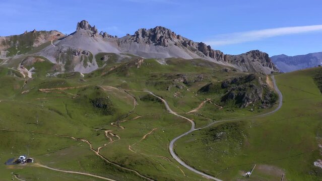 Drone view of mountain bike paths lost in the nature with mountains in background - Tignes drone view - Aiguille Perc&eacute;e