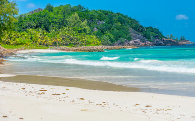 Obraz premium Anse Kerlan beach under a blue sky