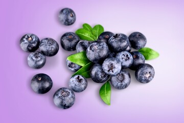 Tasty fresh ripe blueberries on the desk