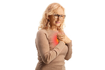 Woman in pain holding her chest with red spot