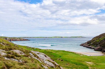 Sea coast and a beach in Scotland. Beautiful nature on a cloudy, but beautiful day.