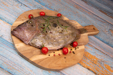 Saint-Pierre Seafish, Zeus Faber, John Dory, Pez de San Pedro, fish, isolated on cutting board...