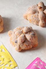 delicious bread of the dead sprinkled with sugar and filled with cheese and chocolate, traditional bread from Mexico November 2