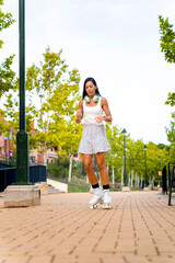 Middle aged woman skating her roller skates down the street