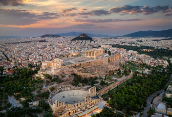 Fototapeta na wymiar Panoramic aerial view of the Parthenon Temple and the Odeon of Herodes Atticus Theatre at the Acropolis of Athens, Greece, during sunset time
