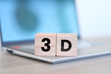 3D text on block cubes with laptop in the background, three dimensional and design idea, wooden...