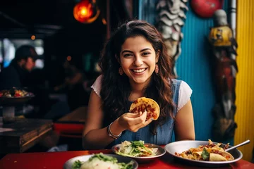 Zelfklevend Fotobehang Mexican woman eating tacos   © Olga