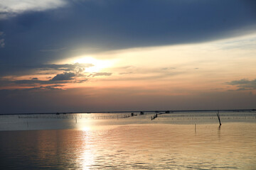 Fototapeta na wymiar Lifestyle of fisherman with motor fisherman boat with sunset sky