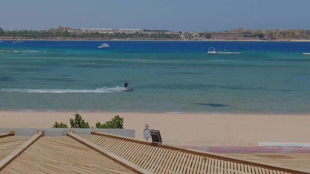 In Hurghada, Egypt, a man enjoys parasurfing as part of his vacation.