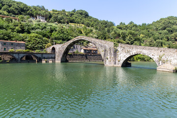 Fototapeta na wymiar Medieval Devil's Bridge - Ponte della Maddalena near the village of Borgo a Mozzano in Tuscany; Italy.