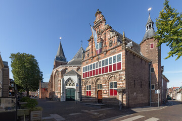 Fototapeta na wymiar City museum and Peter's Church - Peterskerk, in the center of the Dutch city of Woerden.