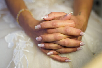 hands of the bride with beautiful fingernails
