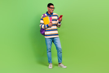 Full body photo of browsing phone nerd funny geek man student bring notebook materials waiting...