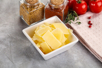 Sliced parmesan cheese in the bowl