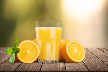 Fresh sweet orange juice in glass on table