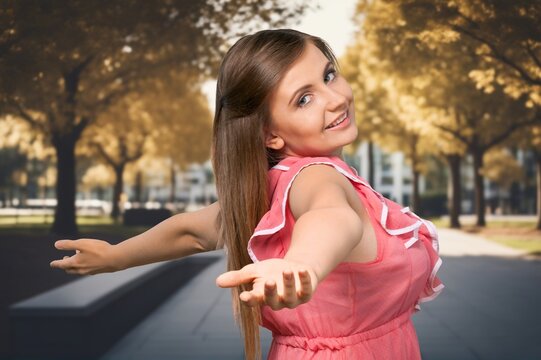 Beautiful young girl walks in city center, AI generated image