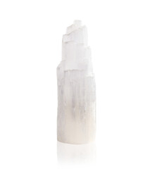 Isolated selenite crystal. Chakra healing and mediation rock or gemstone. Peaceful, calming and mental clarity properties for spirituality, healing and chakras. Selective focus.