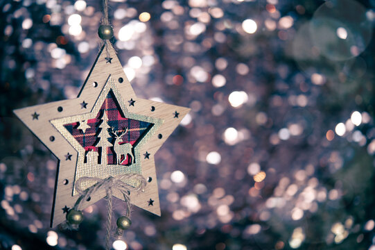 Beautiful Christmas star with deer. Winter and Christmas bokeh texture concept. Christmas ornaments and New Year home décor design. 