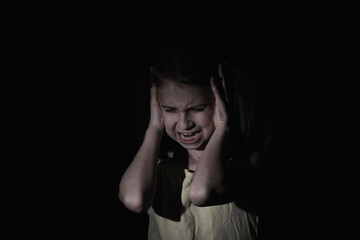 Crying young girl. Loneliness, pain, child tragedy concept.