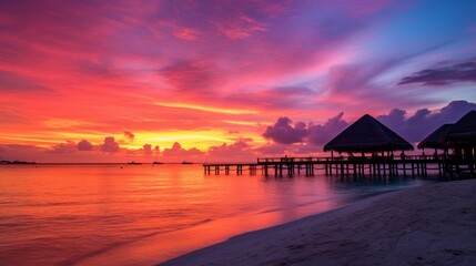 A stunning sunset scene on a beach in the Maldives.