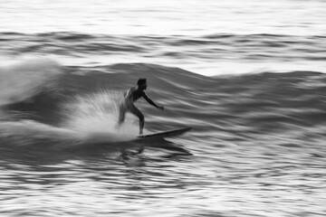 Local surfer riding waves