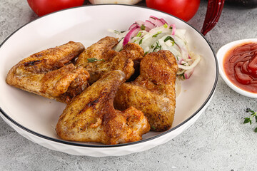 Grilled chicken wings with sauce