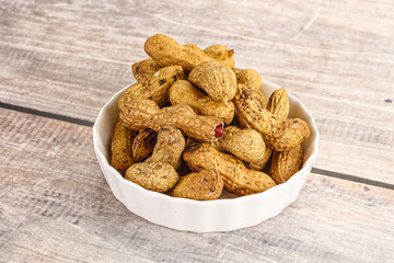 Raw ripe unpeeled peanut heap