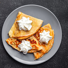 fresh crepes whipped cream tasty pancakes portion sweet dessert appetizer meal food snack on the table copy space food background rustic top view