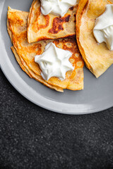 fresh crepes whipped cream tasty pancakes portion sweet dessert appetizer meal food snack on the table copy space food background rustic top view